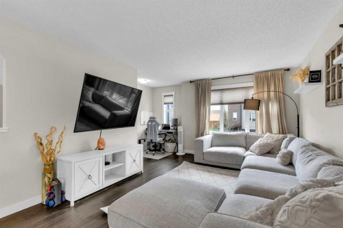 305-2461 Baysprings Link Sw, Airdrie, AB - Indoor Photo Showing Living Room
