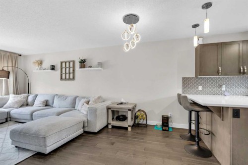 305-2461 Baysprings Link Sw, Airdrie, AB - Indoor Photo Showing Living Room