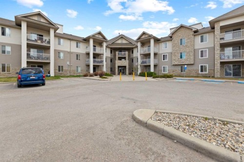 2219-2600 66 Ne, Calgary, AB - Outdoor With Facade