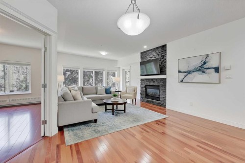 120-20 Discovery Ridge Close Sw, Calgary, AB - Indoor Photo Showing Living Room With Fireplace