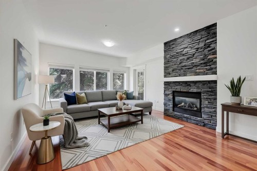 120-20 Discovery Ridge Close Sw, Calgary, AB - Indoor Photo Showing Living Room With Fireplace