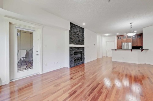 120-20 Discovery Ridge Close Sw, Calgary, AB - Indoor Photo Showing Living Room With Fireplace