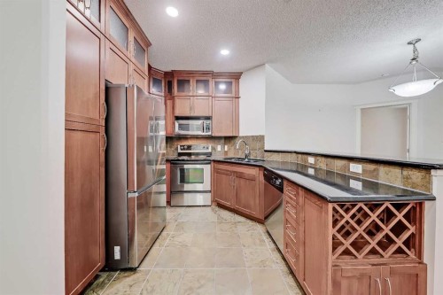 120-20 Discovery Ridge Close Sw, Calgary, AB - Indoor Photo Showing Kitchen With Stainless Steel Kitchen With Double Sink