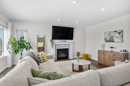 42 Gleneagles Terrace, Cochrane, AB - Indoor Photo Showing Living Room With Fireplace