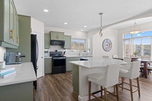 42 Gleneagles Terrace, Cochrane, AB - Indoor Photo Showing Kitchen With Stainless Steel Kitchen With Upgraded Kitchen