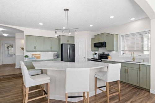 42 Gleneagles Terrace, Cochrane, AB - Indoor Photo Showing Kitchen With Stainless Steel Kitchen With Upgraded Kitchen