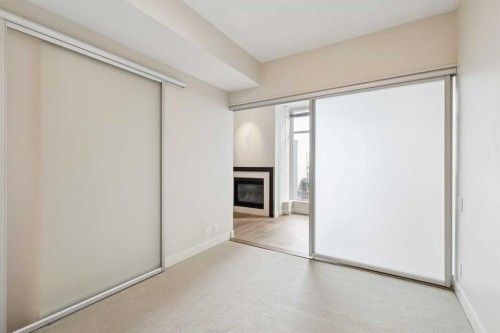 416-222 Riverfront Avenue Sw, Calgary, AB - Indoor Photo Showing Other Room With Fireplace