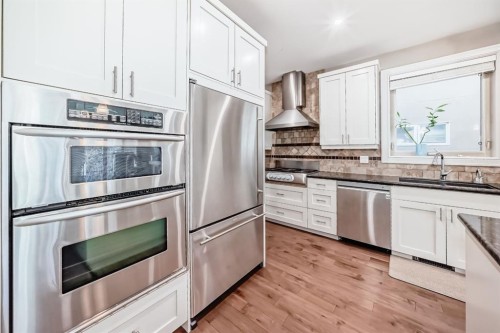 55 Aspen Meadows Green Sw, Calgary, AB - Indoor Photo Showing Kitchen With Stainless Steel Kitchen With Double Sink With Upgraded Kitchen
