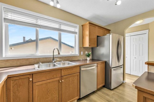 247 Evermeadow Avenue Sw, Calgary, AB - Indoor Photo Showing Kitchen With Double Sink