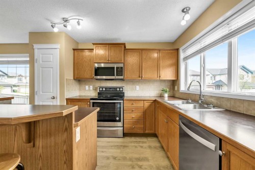 247 Evermeadow Avenue Sw, Calgary, AB - Indoor Photo Showing Kitchen With Double Sink