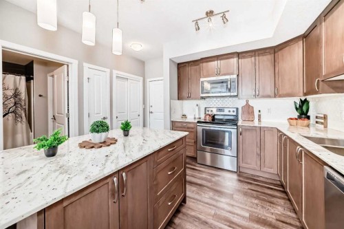 1212-3727 Sage Hill Drive Nw, Calgary, AB - Indoor Photo Showing Kitchen With Stainless Steel Kitchen With Double Sink With Upgraded Kitchen