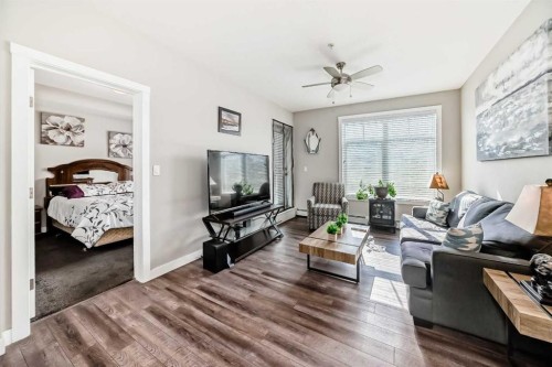 1212-3727 Sage Hill Drive Nw, Calgary, AB - Indoor Photo Showing Living Room