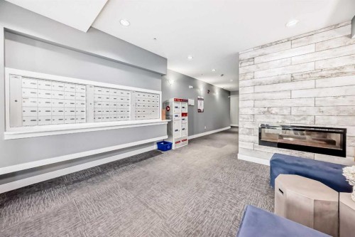 1212-3727 Sage Hill Drive Nw, Calgary, AB - Indoor With Fireplace