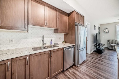 1212-3727 Sage Hill Drive Nw, Calgary, AB - Indoor Photo Showing Kitchen With Stainless Steel Kitchen With Double Sink