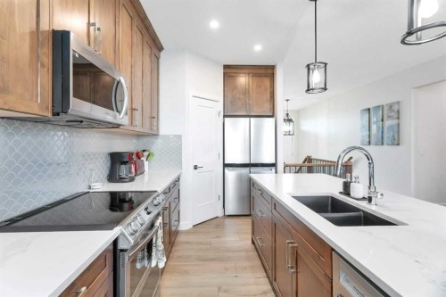 11 Vireo Avenue, Olds, AB - Indoor Photo Showing Kitchen With Stainless Steel Kitchen With Double Sink With Upgraded Kitchen