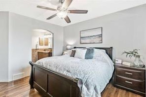 105 Cimarron Park Circle, Okotoks, AB - Indoor Photo Showing Bedroom
