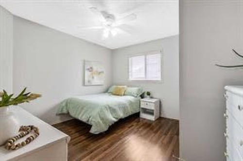 105 Cimarron Park Circle, Okotoks, AB - Indoor Photo Showing Bedroom