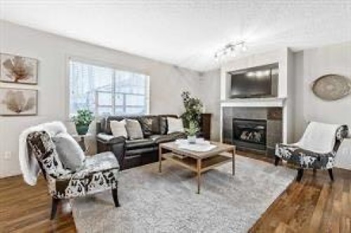 105 Cimarron Park Circle, Okotoks, AB - Indoor Photo Showing Living Room With Fireplace