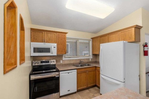 630 69 Avenue Sw, Calgary, AB - Indoor Photo Showing Kitchen With Double Sink