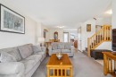 146 Cranberry Close Se, Calgary, AB  - Indoor Photo Showing Living Room 