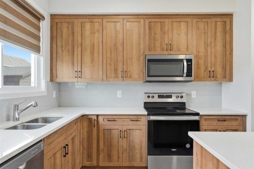 1612 Rangeview Drive Se, Calgary, AB - Indoor Photo Showing Kitchen With Double Sink