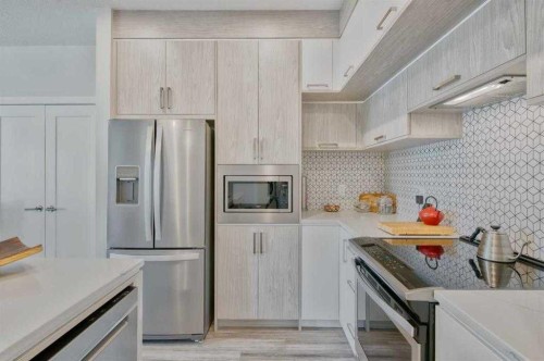 509-138 Sage Valley Common Nw, Calgary, AB - Indoor Photo Showing Kitchen With Stainless Steel Kitchen