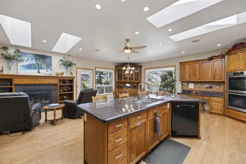 30344 Range Road 15, Rural Mountain View County, AB - Indoor Photo Showing Kitchen With Fireplace With Double Sink