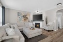 176 Chapalina Heights Se, Calgary, AB  - Indoor Photo Showing Living Room With Fireplace 