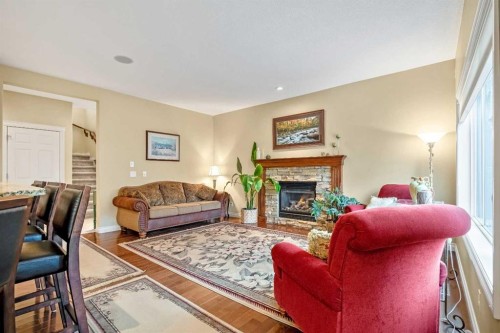 1503 Montgomery Place Se, High River, AB - Indoor Photo Showing Living Room With Fireplace
