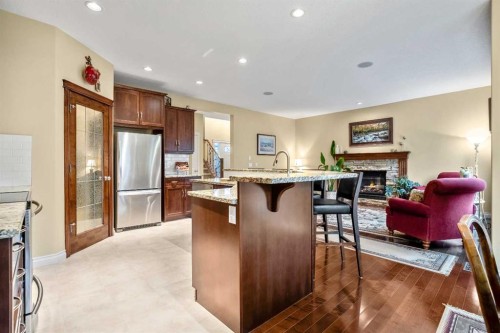 1503 Montgomery Place Se, High River, AB - Indoor Photo Showing Kitchen With Fireplace With Stainless Steel Kitchen
