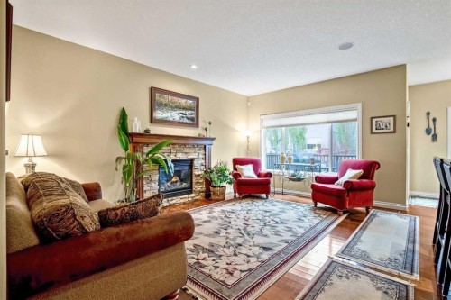 1503 Montgomery Place Se, High River, AB - Indoor Photo Showing Living Room With Fireplace