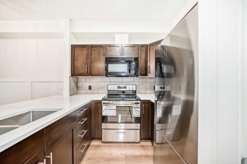 101-22 Panatella Road Nw, Calgary, AB - Indoor Photo Showing Kitchen