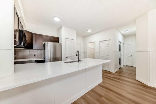 101-22 Panatella Road Nw, Calgary, AB - Indoor Photo Showing Kitchen With Double Sink