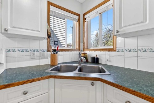 100 Tuscany Way Nw, Calgary, AB - Indoor Photo Showing Kitchen With Double Sink