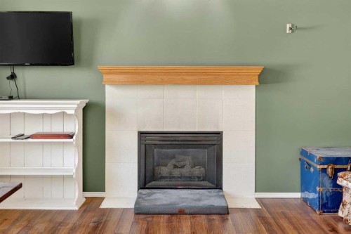 100 Tuscany Way Nw, Calgary, AB - Indoor Photo Showing Living Room With Fireplace