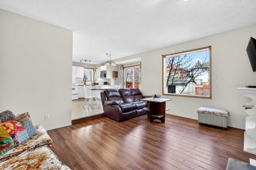 100 Tuscany Way Nw, Calgary, AB - Indoor Photo Showing Living Room