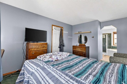 100 Tuscany Way Nw, Calgary, AB - Indoor Photo Showing Bedroom