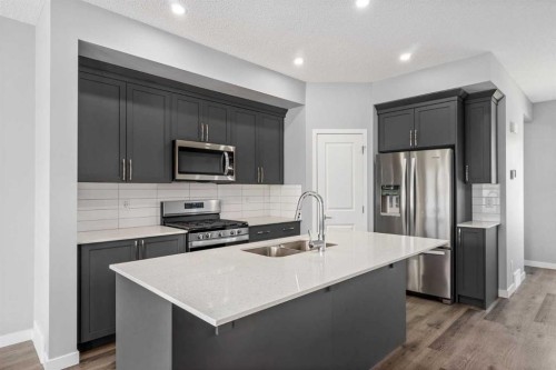109 Dawson Drive, Chestermere, AB - Indoor Photo Showing Kitchen With Double Sink With Upgraded Kitchen