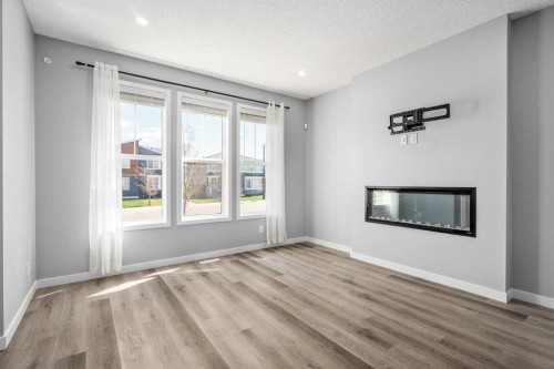 109 Dawson Drive, Chestermere, AB - Indoor Photo Showing Living Room With Fireplace