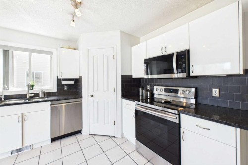 24 Chaparral Ridge Circle Se, Calgary, AB - Indoor Photo Showing Kitchen With Stainless Steel Kitchen