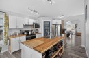 38 Canoe Circle Sw, Airdrie, AB  - Indoor Photo Showing Kitchen With Double Sink 