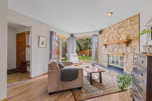 28 Ranchridge Way Nw, Calgary, AB - Indoor Photo Showing Living Room With Fireplace