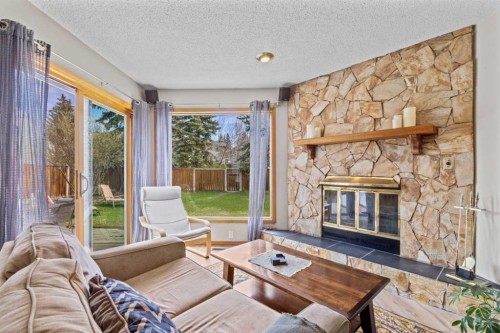 28 Ranchridge Way Nw, Calgary, AB - Indoor Photo Showing Living Room With Fireplace