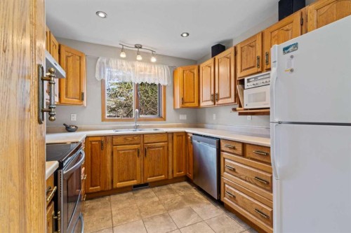 28 Ranchridge Way Nw, Calgary, AB - Indoor Photo Showing Kitchen With Double Sink