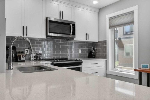241 Auburn Meadows Drive Se, Calgary, AB - Indoor Photo Showing Kitchen With Stainless Steel Kitchen With Double Sink With Upgraded Kitchen