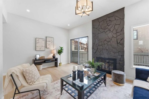 28-99 Midpark Gardens Se, Calgary, AB - Indoor Photo Showing Living Room With Fireplace