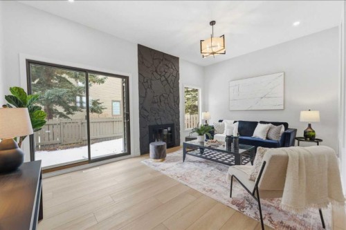 28-99 Midpark Gardens Se, Calgary, AB - Indoor Photo Showing Living Room With Fireplace