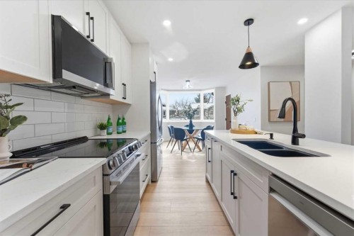 28-99 Midpark Gardens Se, Calgary, AB - Indoor Photo Showing Kitchen With Double Sink With Upgraded Kitchen