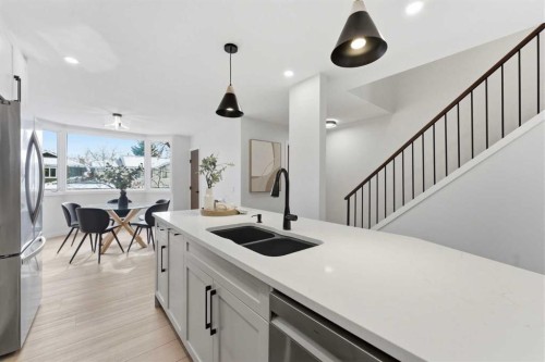 28-99 Midpark Gardens Se, Calgary, AB - Indoor Photo Showing Kitchen With Stainless Steel Kitchen With Double Sink With Upgraded Kitchen