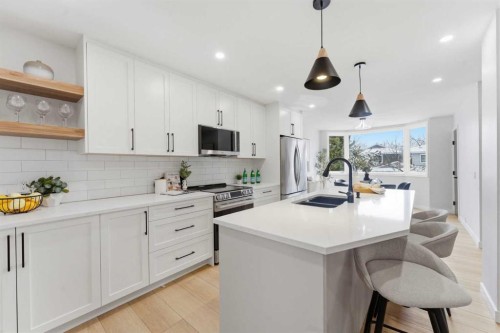 28-99 Midpark Gardens Se, Calgary, AB - Indoor Photo Showing Kitchen With Stainless Steel Kitchen With Double Sink With Upgraded Kitchen